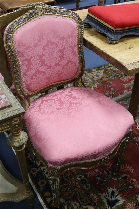A set of four Louis XVI style carved gilt-framed salon chairs